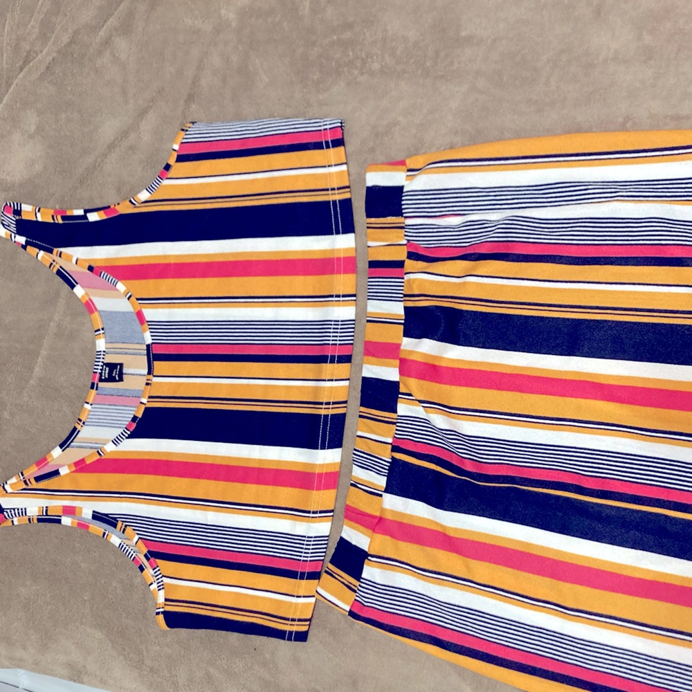 Matching set. Multi colored. Mid drift and mini skirt.
